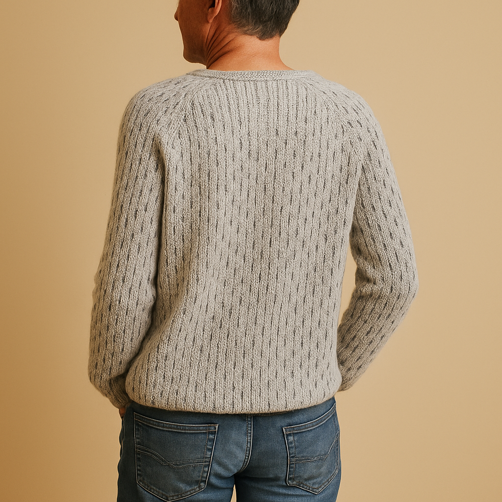 Women’s knitted grey winter sweater with relaxed fit, breathable knit fabric, and elegant texture, perfect for layering in casual or formal looks.