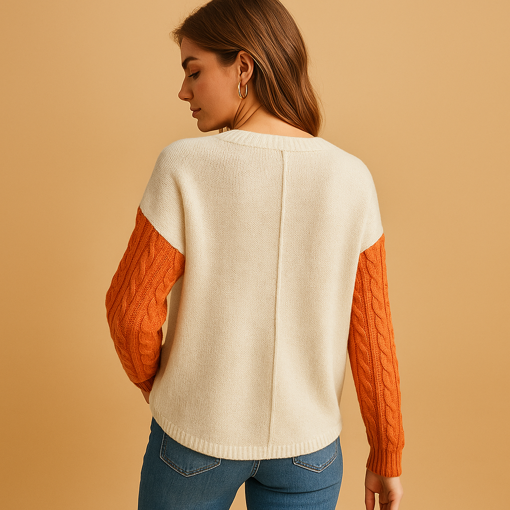 Women’s knitted sweater with cable pattern, relaxed fit, dropped shoulders, and pocket detail. Perfect for casual outfits, layering, or cozy days at home.