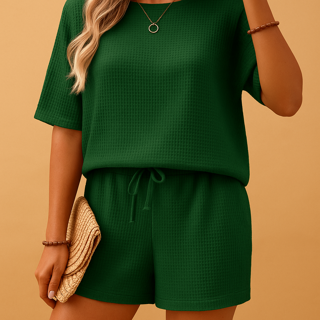 Women’s relaxed loungewear set with round-neck top and elastic shorts, perfect for lounging at home or casual sunny days.