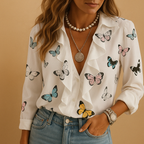 Elegant women’s blouse with butterfly print and ruffles, featuring long sleeves and a flattering tailored fit for all-season wear.