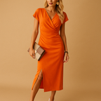 Chic V-neck midi dress for women with front slit, elegant fit, and flowing fabric, perfect for parties, dinners, or everyday wear.