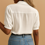 Elegant white blouse for women with classic collar and button closure, perfect for work, leisure, or stylish everyday wear.