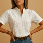 Elegant white blouse for women with classic collar and button closure, perfect for work, leisure, or stylish everyday wear.