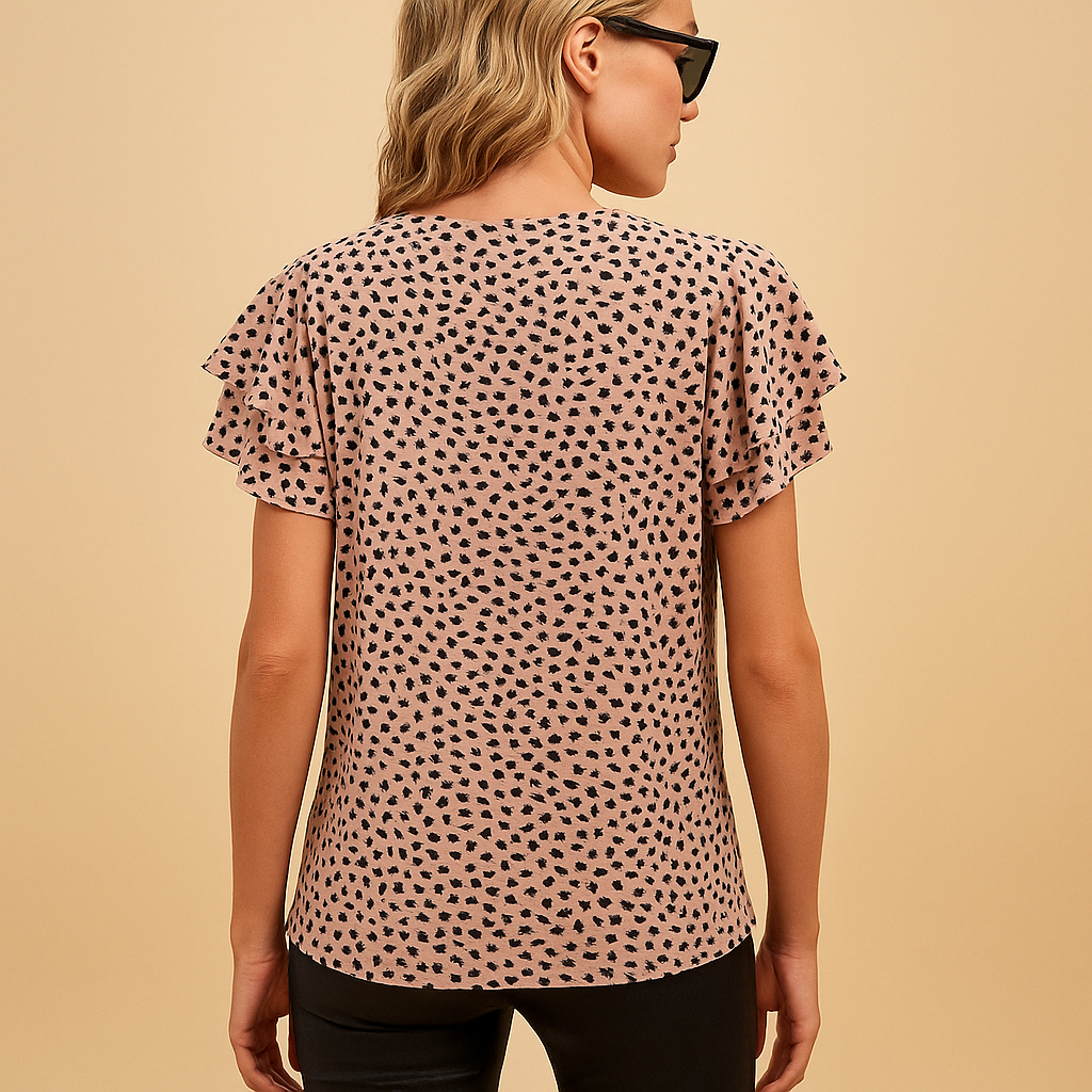 Women’s bold print flowy top with a flattering fit and elegant style, perfect for casual outings or chic occasions.
