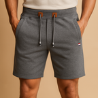 Men’s breathable sport shorts with elastic waistband and multiple pockets, available in black, green, gray, beige, and blue for versatile use.