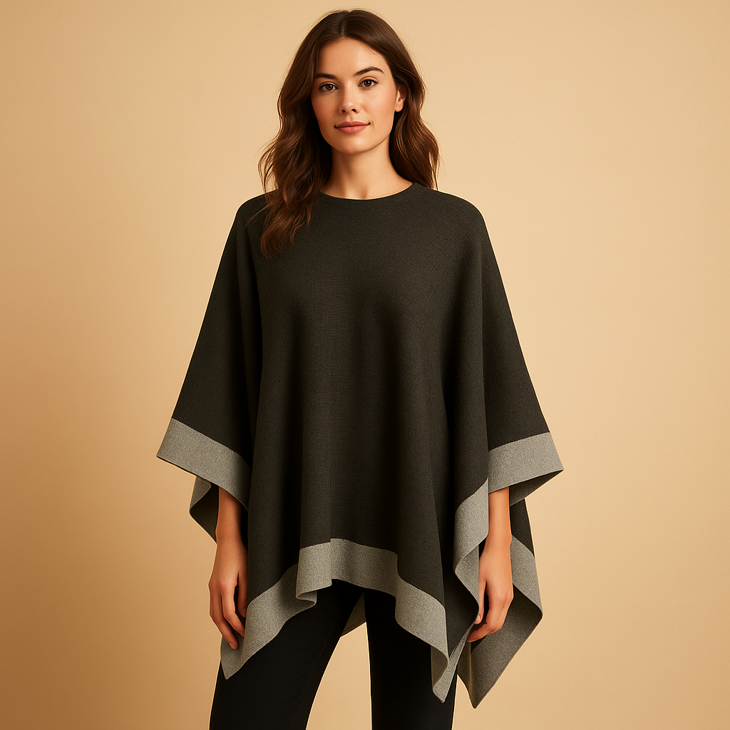 Women’s elegant poncho with flowing silhouette, open sides, and soft faux cashmere fabric. Ideal for autumn and winter layered outfits.