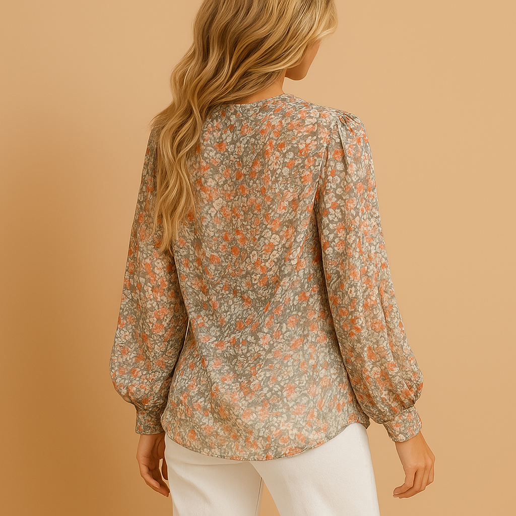 Elegant floral summer blouse for women with long sleeves and light fabric, perfect for warm days and versatile outfits.