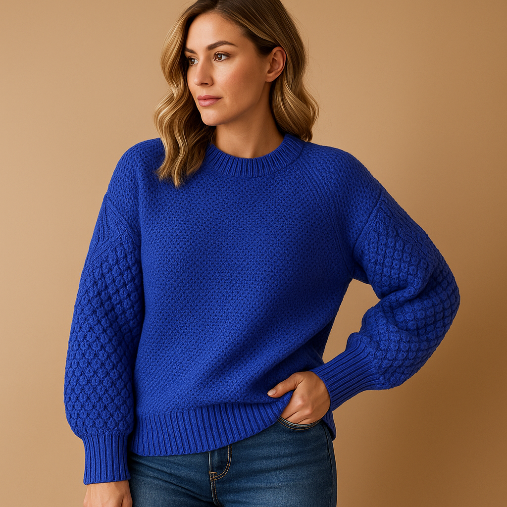 Women’s knitted winter sweater with tailored relaxed fit, soft lightweight fabric, and minimalist design in neutral winter tones for stylish wear.