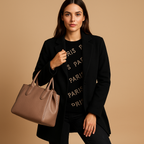 Women’s long elegant jacket with classic silhouette, refined finish, and flattering cut. Available in neutral tones for versatile autumn and winter wear.