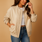 Naomi long leather coat for women with tailored fit, extended length, and baseball-style details. Available in Black, Brown, and Beige.