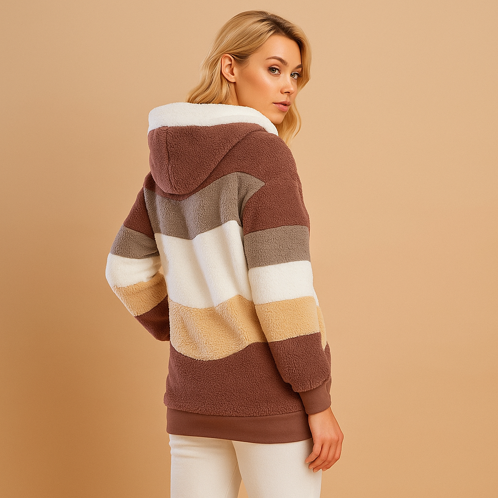 Long plush winter coat for women in warm neutral colors, offering cozy comfort and elegant style for cold days.