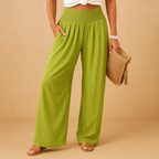 Women’s loose summer pants with elastic waistband and wide legs, breathable and lightweight fabric, ideal for warm casual days.