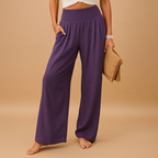 Women’s loose summer pants with elastic waistband and wide legs, breathable and lightweight fabric, ideal for warm casual days.