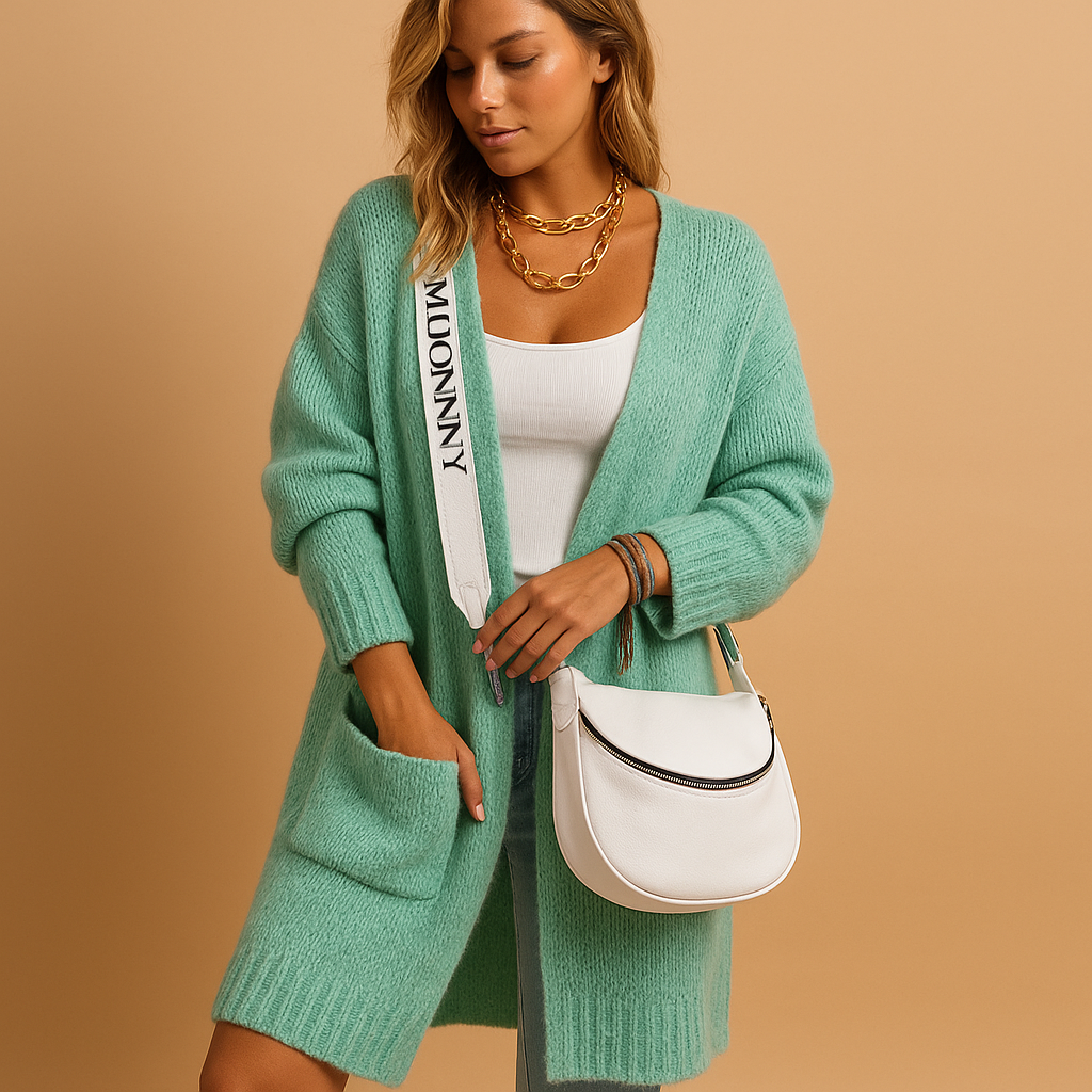 Women’s oversized open cardigan with flowing fit, open front, and refined tailored details. Lightweight and stylish for chic layered outfits.